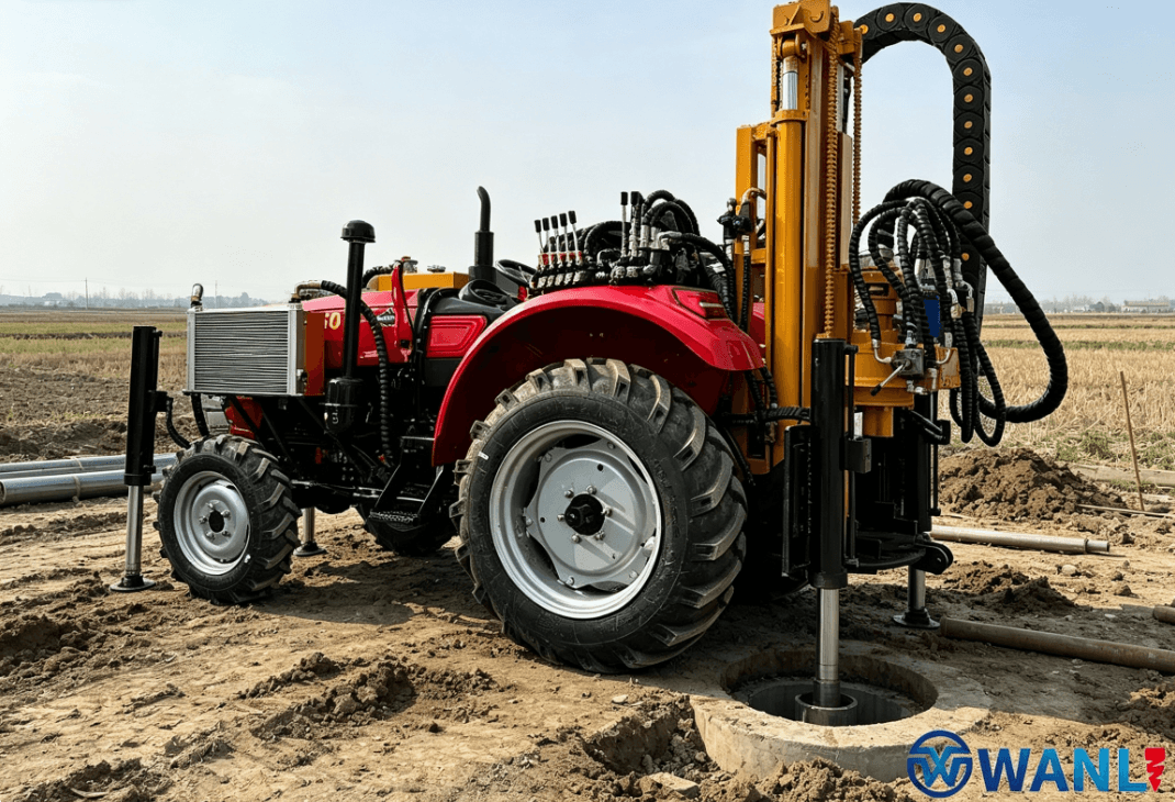 Tractor-mounted water well drilling rig positioned over a borehole